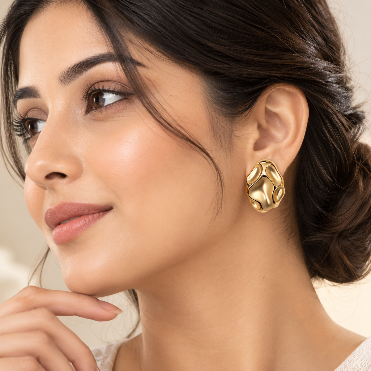 Petra Pebble Studs gold pebble earrings worn on model